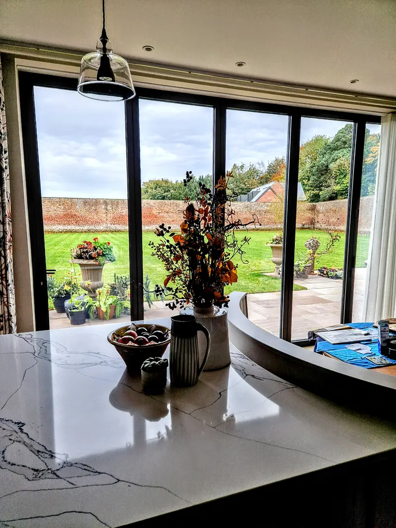Bifold doors off a kitchen, slim interlocks