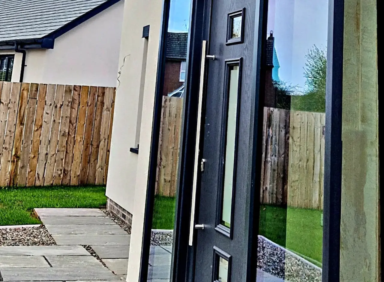 Contemporary aluminium entrance door and glazed side light