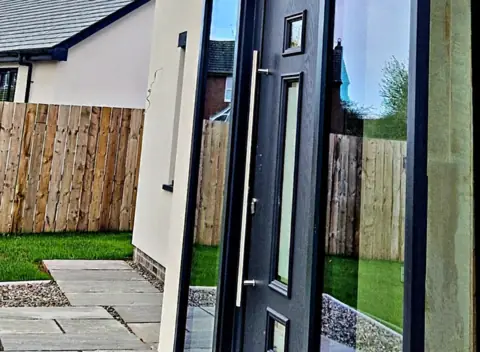 Anthracite entrance door, modern elevation