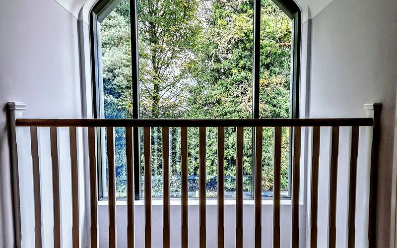 Arched heritage window with astragal bars