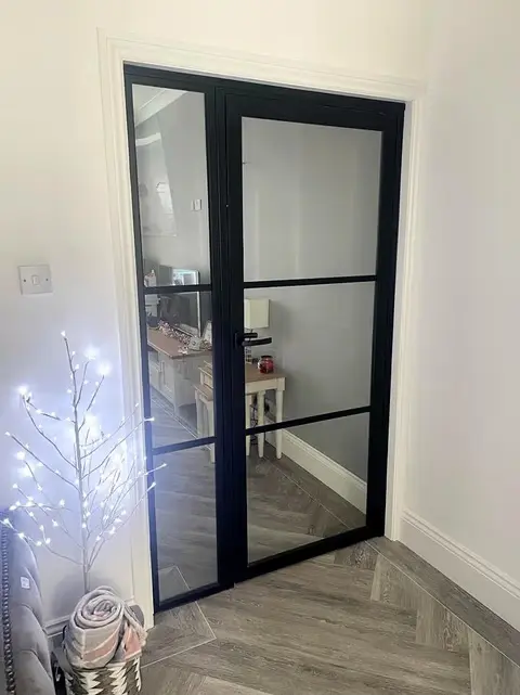 Steel-look internal doors off a kitchen